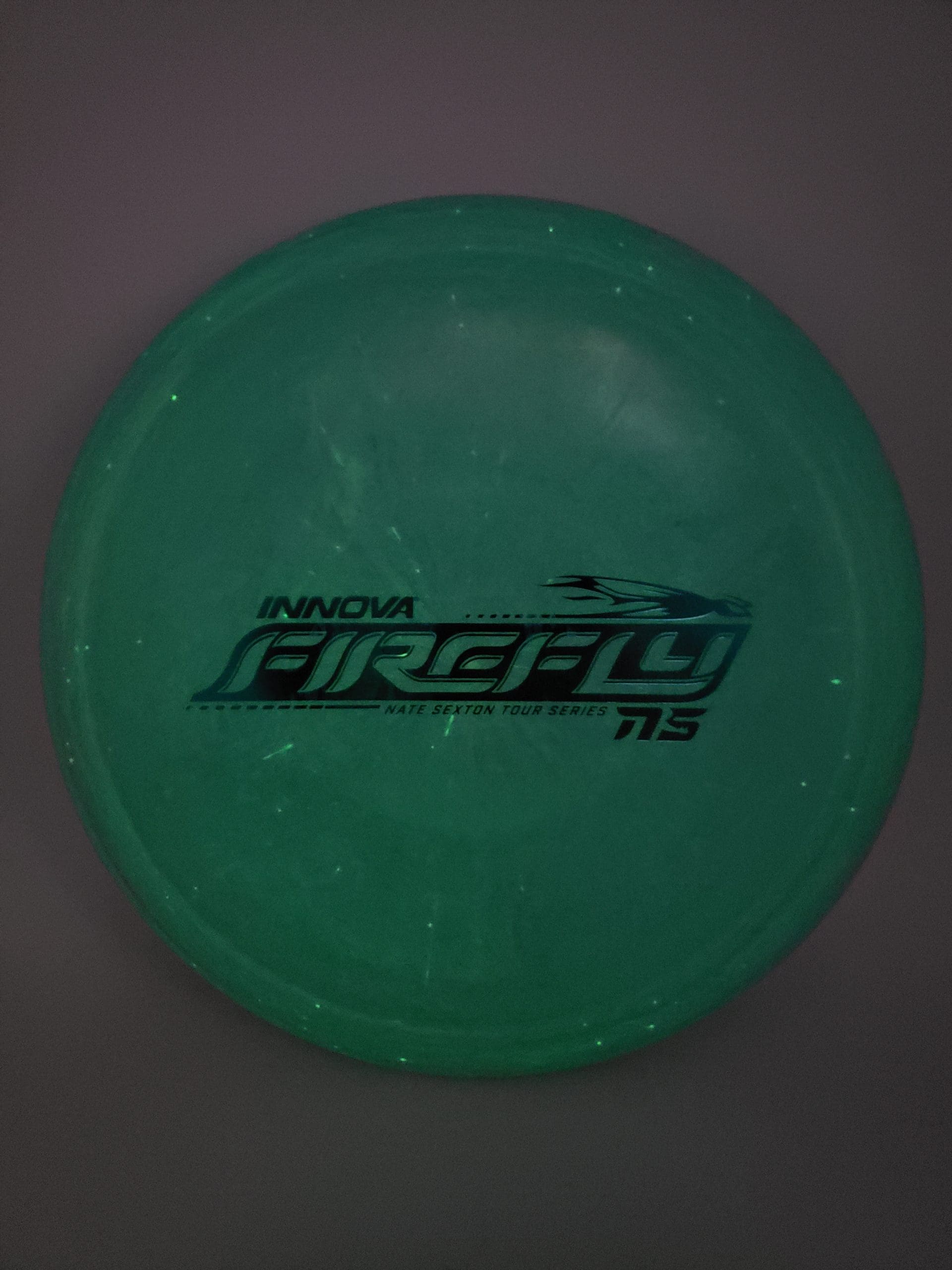 Innova tour series Nate Sexton Nexus Glow Firefly disc golf disc front view